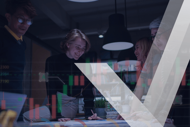 Team analyzing financial data with overlaid stock market charts.